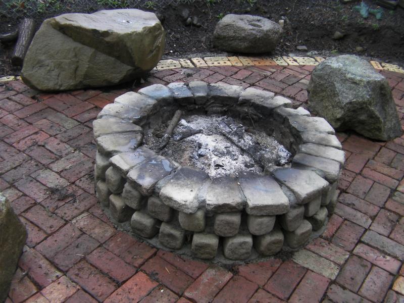 Sand Stone Cobble Brick fire place to enhance old red brick patio.