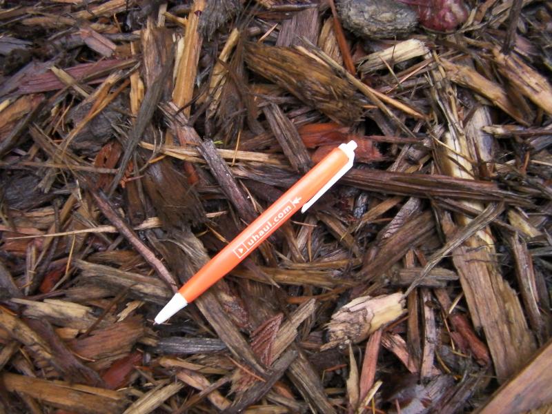 Medium Red 4 inch Minus Hog Fuel with pen to help show approx size.
