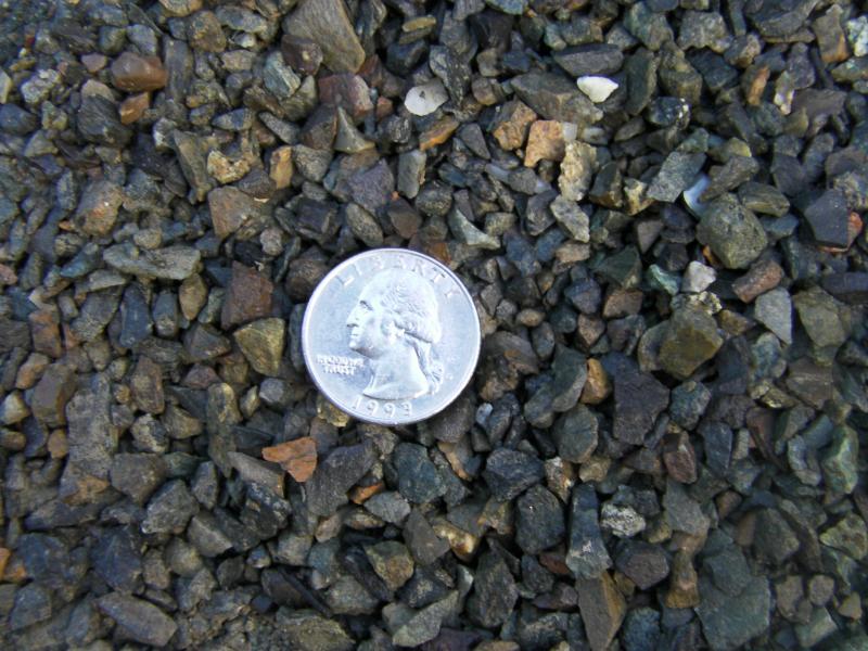1/4 to dust crushed rock.  Compacts good.