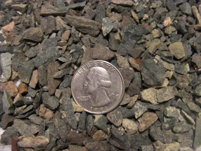 3/8th chip rock with no fines.  Quarter used to help show size.